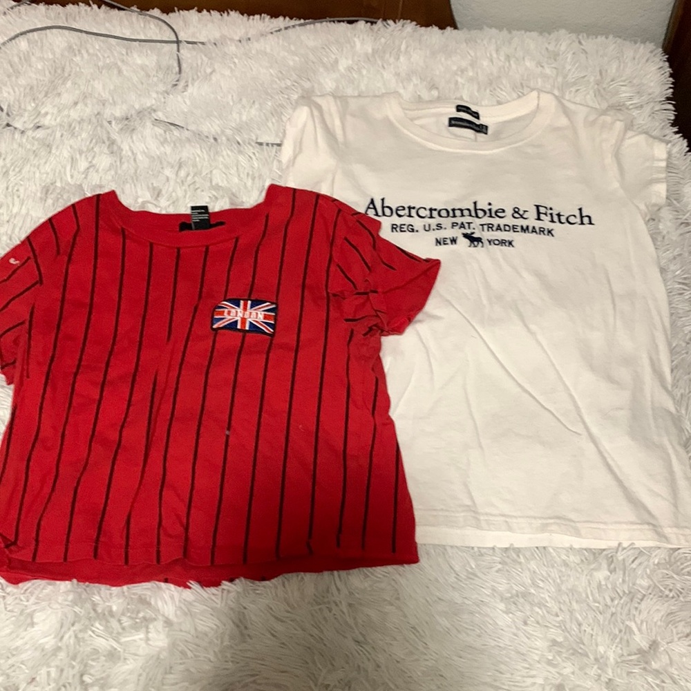 2 shirts , one red with black stripes and one white Abercrombie shirt